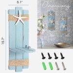 Two blue wooden starfish wall candle sconces with hemp rope accents, holding small candles, mounted against a light wall.
